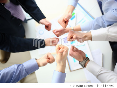 Close-up of cooperative business people showing increased cohesion Close-up of cooperative business people showing increased cohesion 108117260