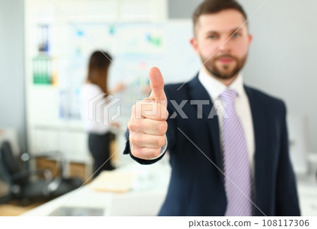 Smiling man working in office Smiling man working in office 108117306