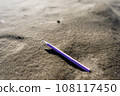 Pencil abandoned on the beach 108117450