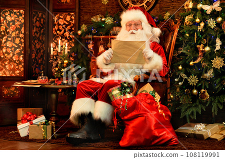 Santa Claus in a traditional costume with a bag of gifts Santa Claus in a traditional costume with a bag of gifts 108119991