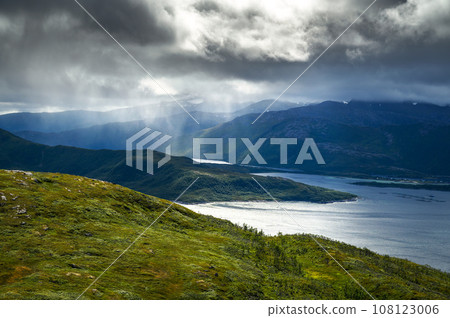 Storm clouds over the mountains and fjord on Senja Island, northern Norway 108123006