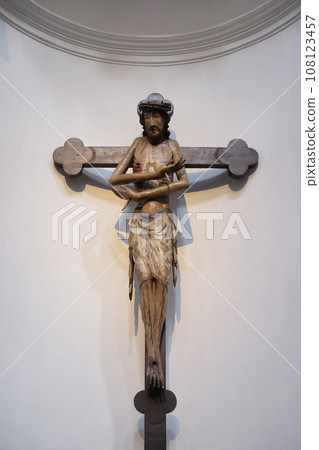 Schmerzensmannkreuz, Jesus on the cross, his arms crossed like a gesture of embrace, Neumunster Collegiate Church in Wurzburg, Germany 108123457