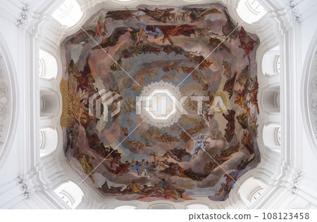 Adoration of the Holy Trinity by saints and angels ceiling fresco in Neumunster Collegiate Church in Wurzburg, Germany 108123458