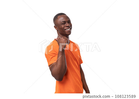young positive happy american man in orange t-shirt with mock up isolated on white background 108123589