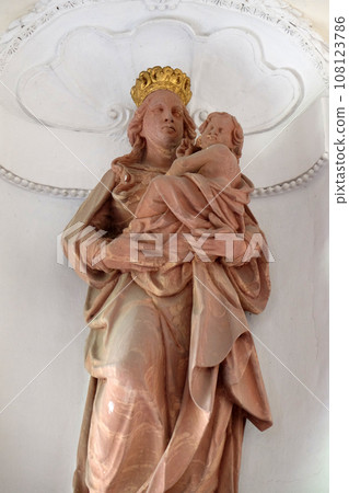 Virgin Mary with baby Jesus statue in Amorbach Benedictine abbey in Lower Franconia, Bavaria, Germany 108123786