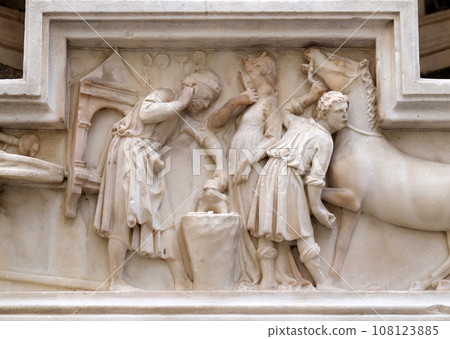 The miracle of Saint Eligius. Tabernacle bas-relief of a horseschoer made by Nanni di Banco and part of an external wall of Orsanmichele Church in Florence, Tuscany, Italy 108123885