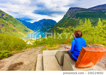 Tourist enjoying Geirangerfjord from viewing point 108124692