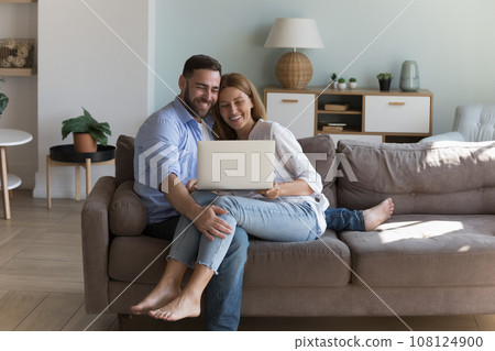 Happy joyful young couple in love enjoying leisure at home Happy joyful young couple in love enjoying leisure at home 108124900