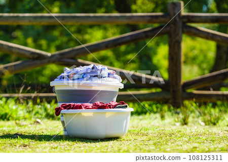 Washing laundry on holidays trip. 108125311