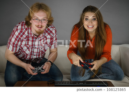 Gaming couple playing games 108125865