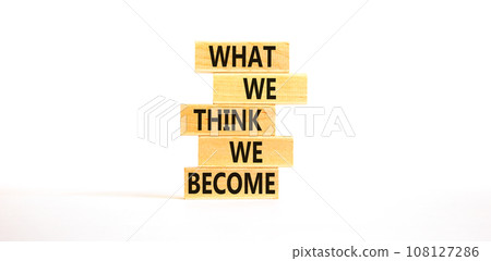 We become or think symbol. Concept word What we think We become on wooden block. Beautiful white table white background. Business we become or think concept. Copy space. 108127286