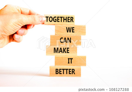 Together make better symbol. Concept words Together we can make it better on wooden block. Beautiful white table white background. Businessman hand. Business we make it better concept. Copy space. Together make better symbol. Concept words Together we can make it better on wooden block. Beautiful white table white background. Businessman hand. Business we make it better concept. Copy space. 108127288