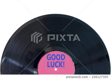 Good luck symbol. Concept words Good luck on beautiful black old retro vinyl disc. Beautiful white table white background. Business, motivational good luck concept. Copy space. 108127305