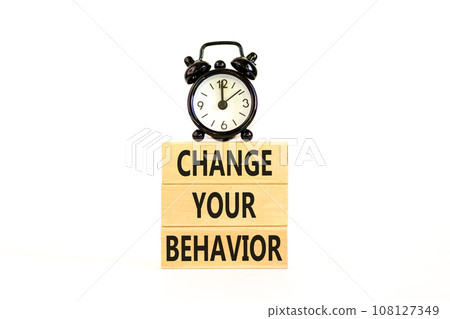 Motivation and Change your behavior symbol. Concept words Change your behavior on wooden block on a beautiful white table white background. Business change your behavior concept. Copy space. 108127349