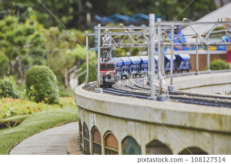 Toy train in a miniature city in Madurodam park, Netherlands Toy train in a miniature city in Madurodam park, Netherlands 108127514