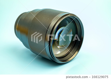 Optical digital camera lens isolated on blue background Optical digital camera lens isolated on blue background 108129075