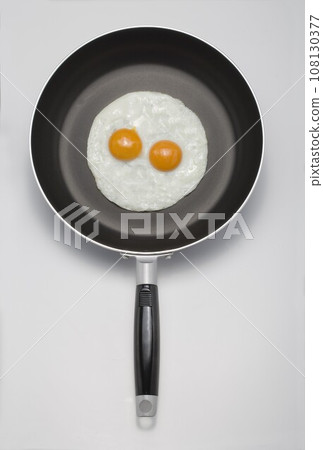 Frying pan with fried egg 108130377