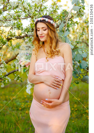 Beautiful pregnant woman relaxing in the park. Happy pregnant woman Beautiful pregnant woman relaxing in the park. Happy pregnant woman 108130436