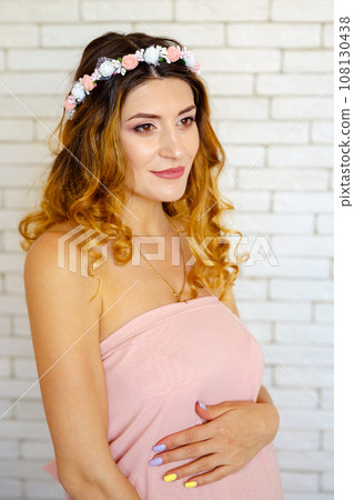 Beautiful model girl with long red curly hair. Cheerful gorgeous woman Beautiful model girl with long red curly hair. Cheerful gorgeous woman 108130438