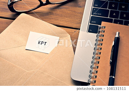 A desk with a card that says KPT A desk with a card that says KPT 108131511