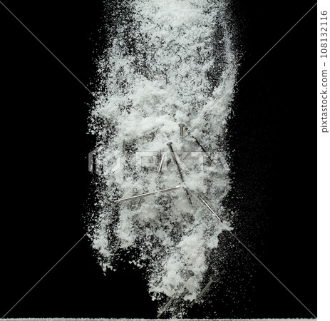 Nail spike under snow on road. Dangerous sharpen nail glass thing hidden in snow and can't see. Snow fall with risk accident hazard cover trash garbage debris. Black background isolated. 108132116