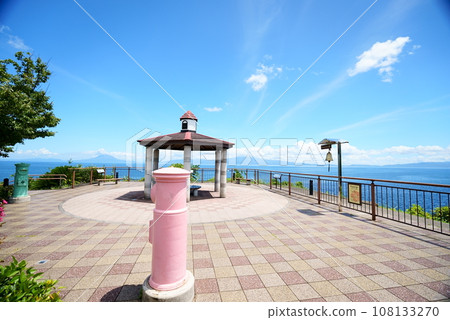 A view of Saikasaikan with pink and green mailboxes 108133270