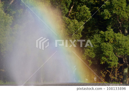 Rainbow formed in the fountain in the park14 Rainbow formed in the fountain in the park14 108133896