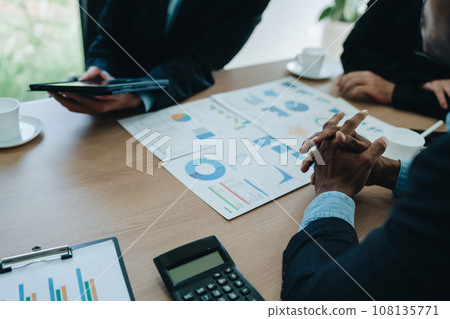 Asian business advisor meeting to analyze and discuss the situation on the financial report in the meeting room.Investment Consultant, Financial , teamwork ,brainstorming ,startup and accounting. Asian business advisor meeting to analyze and discuss the situation on the financial report in the meeting room.Investment Consultant, Financial , teamwork ,brainstorming ,startup and accounting. 108135771