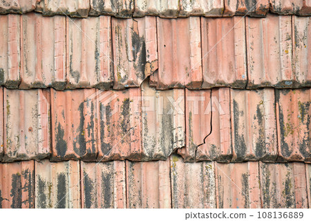 Closeup surface of old weathered ceramic tiles covering building roof 108136889