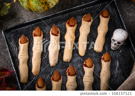 Halloween cookies in shape of witch finger 108137121