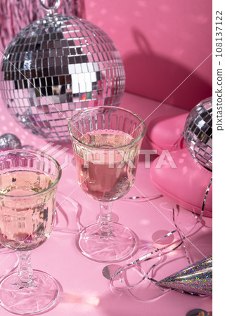 Glass of champagne with silver disco ball 108137122