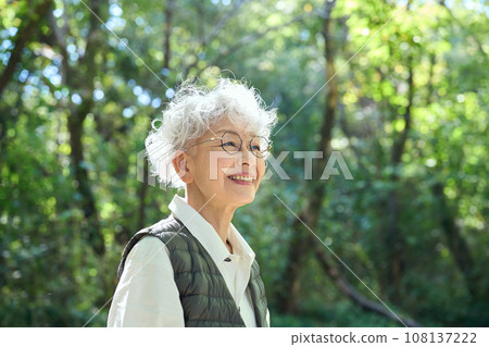 A woman enjoying forest bathing A woman enjoying forest bathing 108137222