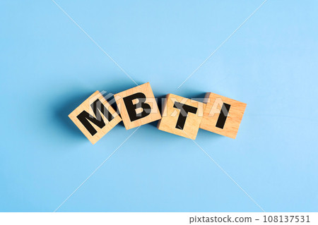 Wooden blocks with the letters MBTI on blue background. Personality typology. Psychology test for human types.MBTI - Myers-Briggs Type Indicator. Wooden blocks with the letters MBTI on blue background. Personality typology. Psychology test for human types.MBTI - Myers-Briggs Type Indicator. 108137531