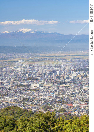 Overhead view of Mt. Gassan mountain range and Yamagata city from the observation plaza in Nishi Zao Park, Yamagata City, Yamagata Prefecture 108138347