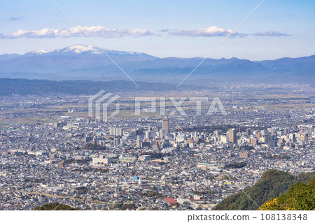 Overhead view of Mt. Gassan mountain range and Yamagata city from the observation plaza in Nishi Zao Park, Yamagata City, Yamagata Prefecture 108138348