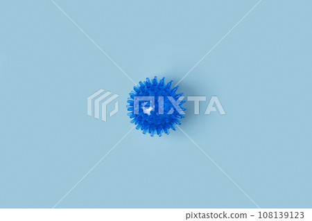 Tactile knobby ball on blue studio background. Sensory massage textured ball. Enhance the cognitive, physical process. Brain development. Support for Children with ADHD, autism, fidgeting. Squeezy toy 108139123