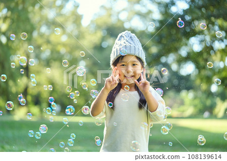 Girl wearing a knit hat Girl wearing a knit hat 108139614