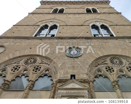 Colorful historic streets of Florence, Italy. Narrow old street, building's facade, brick walls. 108139918