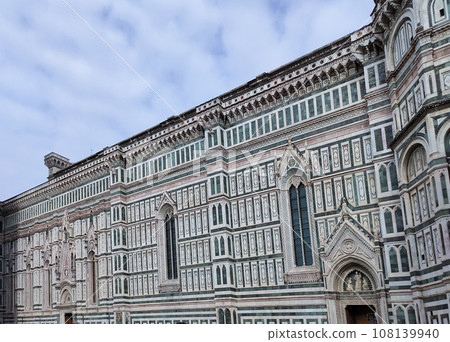Details of the exterior of the di Santa Maria del Fiore or Cathedral of Saint Mary of the Flower - the main church of Florence, Tuscany, Italy. 108139940