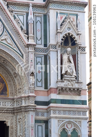 Details of the exterior of the di Santa Maria del Fiore or Cathedral of Saint Mary of the Flower - the main church of Florence, Tuscany, Italy. 108139963