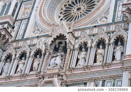 Details of the exterior of the di Santa Maria del Fiore or Cathedral of Saint Mary of the Flower - the main church of Florence, Tuscany, Italy. 108139968