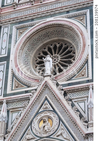 Details of the exterior of the di Santa Maria del Fiore or Cathedral of Saint Mary of the Flower - the main church of Florence, Tuscany, Italy. 108139974
