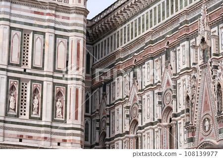 Details of the exterior of the di Santa Maria del Fiore or Cathedral of Saint Mary of the Flower - the main church of Florence, Tuscany, Italy. Details of the exterior of the di Santa Maria del Fiore or Cathedral of Saint Mary of the Flower - the main church of Florence, Tuscany, Italy. 108139977