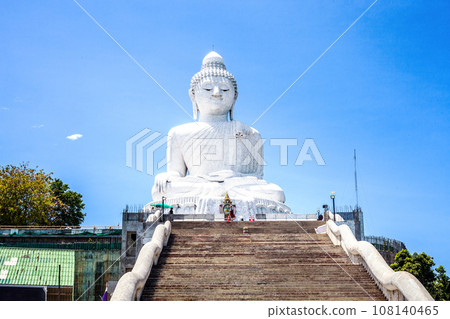 White marble statue of Phuket Big Buddha by blue sky in Thailand 108140465
