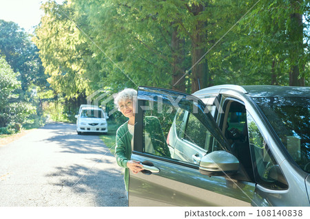 A woman riding a car A woman riding a car 108140838