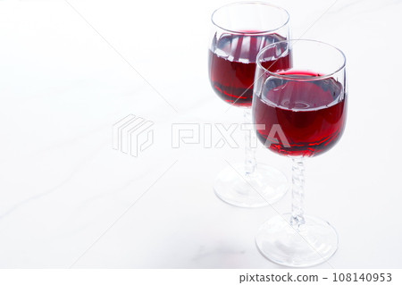 Two wine glasses filled with red wine Two wine glasses filled with red wine 108140953