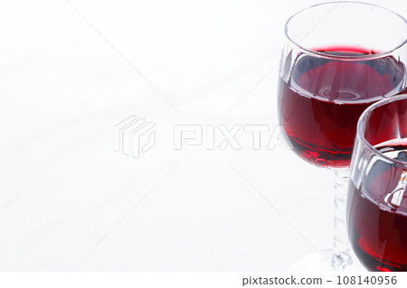 Two wine glasses filled with red wine Two wine glasses filled with red wine 108140956