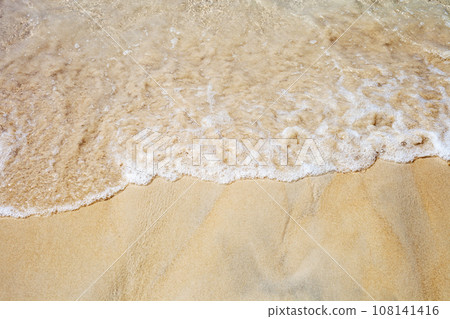 Soft sea waves on sunny sandy beach top view 108141416
