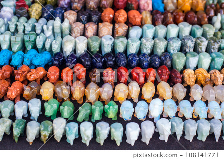 Many small elephants stone figurines at street market, selective focus Many small elephants stone figurines at street market, selective focus 108141771