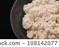 Raw pollack milt on a black plate 108142077